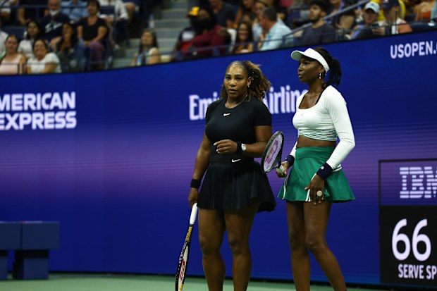 NEW YORK, NEW YORK - SEPTEMBER 01: Serena Williams and Venus Williams of The United States confer against Lucie Hradecka and Linda Noskova of Czech Republic during the Women's Doubles First Round match on Day Four of the 2022 US Open at USTA Billie Jean King National Tennis Center on September 01, 2022 in the Flushing neighborhood of the Queens borough of New York City. (Photo by Elsa/Getty Images)