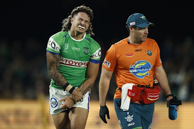 MUDGEE, AUSTRALIA - AUGUST 22: Xavier Savage of the Raiders is attended to after sustaining an injury during the round 25 NRL match between Penrith Panthers and Canberra Raiders at Glen Willow Sporting Complex, on August 22, 2025, in Mudgee, Australia. (Photo by Mark Evans/Getty Images)