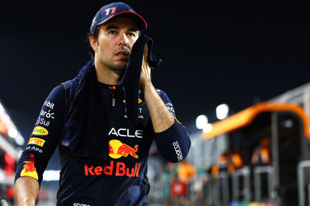Sergio Perez wipes away sweat after a gruelling Qatar Grand Prix.