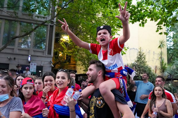 Novak Djokovic fans outside an immigration detention hotel where Serbian Novak Djokovic is confined in Melbourne, Australia, Monday, Jan. 10, 2022. 
