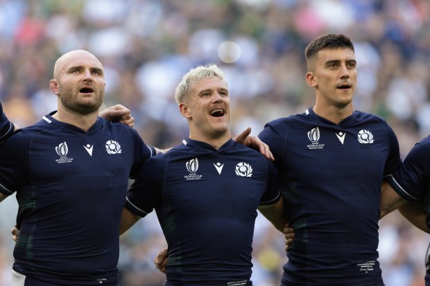 Scotland's Dave Cherry (left) with Darcy Graham (middle) and Cameron Redpath (right) sing the national anthem.
