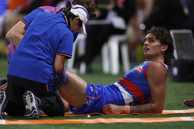 MELBOURNE, AUSTRALIA - MARCH 25: Jamarra Ugle-Hagan of the Bulldogs takes a break on the bench during the round two AFL match between the Western Bulldogs and St Kilda Saints at Marvel Stadium, on March 25, 2023, in Melbourne, Australia. (Photo by Darrian Traynor/Getty Images)