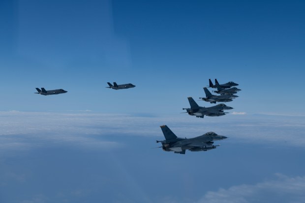 In this photo provided by South Korea Defense Ministry, U.S. and South Korea Air Force fighter jets fly in formation during a joint drill on Tuesday, June, 7, 2022. The South Korean and U.S. militaries flew 20 fighter jets over South Korea's western sea Tuesday in a continued show of force as a senior U.S. official warned of a forceful response if North Korea goes ahead with its first nuclear test explosion in nearly five years.  