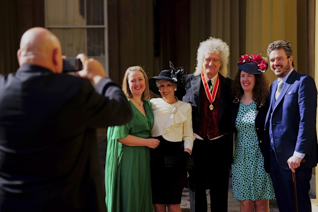 Sir Brian May poses with his family, including wife Anita Dobson, after being made a Knight Bachelor by King Charles III during an investiture ceremony at Buckingham Palace, London, Tuesday March 14, 2023.