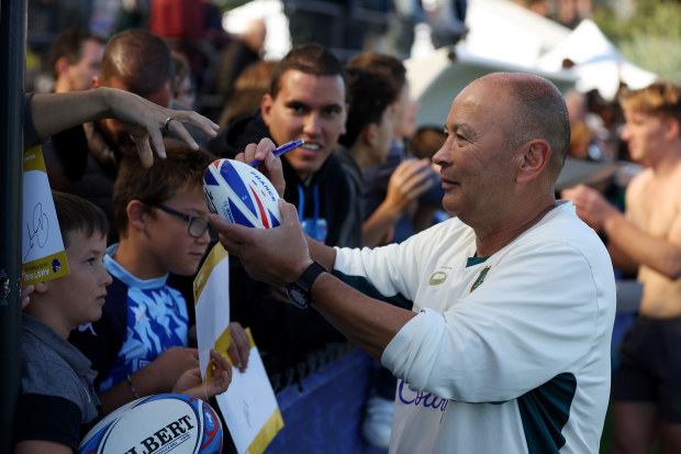 Eddie Jones with fans during a Wallabies training session at Stade Roger Baudras.
