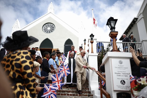 Britain's King Charles III greets members of the public as he departs St Peter's Church during a ceremonial welcome at King's Square on May 1, 2026 in St. George's, Bermuda. King Charles III is in Bermuda for his first visit to a British Overseas Territory as Sovereign.
