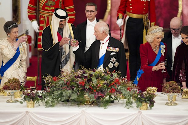 Britain's King Charles III, centre, and Queen Camilla, second right, with the Emir of Qatar Sheikh Tamim bin Hamad Al Thani, second left, and Britain's Princess Anne, left, during a State Banquet at Buckingham Palace, in London, Tuesday, Dec. 3, 2024, during the state visit to the U.K. of the Emir of Qatar and the first of his three wives. 
