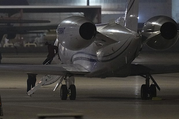 WNBA star Brittney Griner deplanes at Kelly Field in San Antonio, Texas, following her release in a prisoner swap with Russia, Friday, December 9, 2022