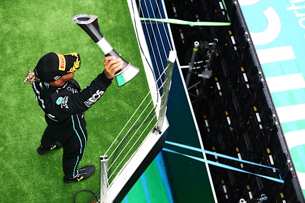 Second placed Lewis Hamilton of Great Britain and Mercedes celebrates on the podium during the F1 Grand Prix of Hungary at Hungaroring on July 31, 2022 in Budapest, Hungary. (Photo by Mark Thompson/Getty Images)