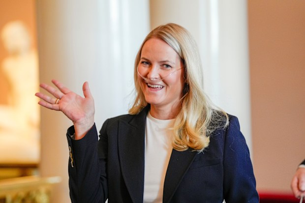 Crown Princess Mette-Marit of Norway waves as she arrives for a reception for the Norwegian athletes from the Paralympics in Milano Cortina 2026 at the Palace on April 10, 2026.