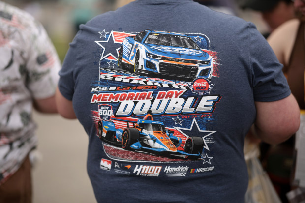 A fan wearing a Kyle Larson "Memorial Day Double" t-shirt.