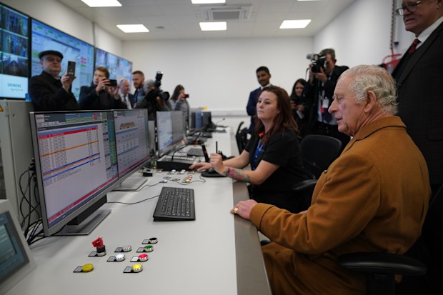 King Charles III is shown the control room during a visit to Luton DART Parkway Station 