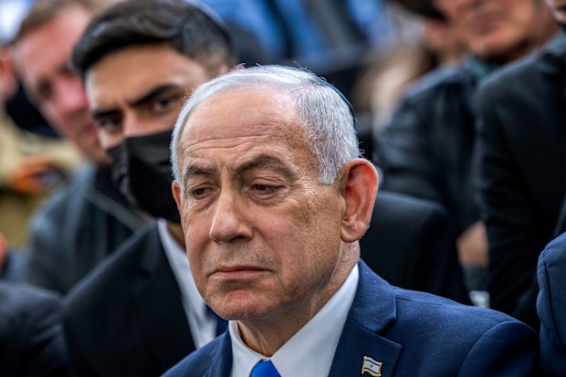 Israel's Prime Minister Benjamin Netanyahu reacts during the funeral of Israeli hostage Ran Gvili, whose remains were brought back to Israel, in the southern town of Meitar on Wednesday, Jan. 28, 2026.(Chaim Goldberg/Pool Photo via AP)