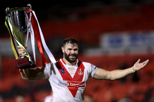 Alex Walmsley of the Saints holds aloft the World Club Challenge trophy after victory  during the World Club Challenge and NRL Trial Match between the Penrith Panthers and St Helens at BlueBet Stadium on February 18, 2023 in Penrith, Australia. (Photo by Mark Metcalfe/Getty Images)
