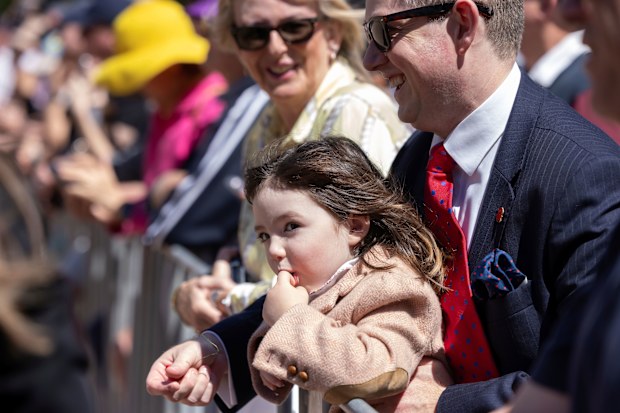 Arabella Harris, 3, and her father Rhydian Harris wait for Princess Anne outside the Anzac Memorial in Hyde Park. The Princess Royal is in Sydney to mark Remembrance. Sunday 9th November 2025. Photo: Sitthixay Ditthavong