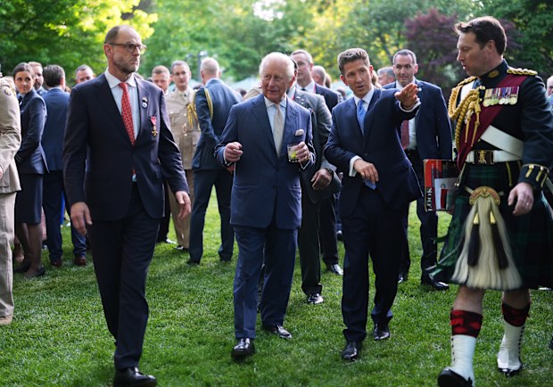Britain's King Charles III and British Ambassador to the U.S. Christian Turner (R) attend a garden party at the British Embassy on day one of King Charles III and Queen Camilla's State Visit to the United States of America on April 27, 2026 in Washington, D.C. The visit will include stops at the nation's capital, New York City, and Virginia, arranged to celebrate the United States of America's 250th anniversary of its independence.