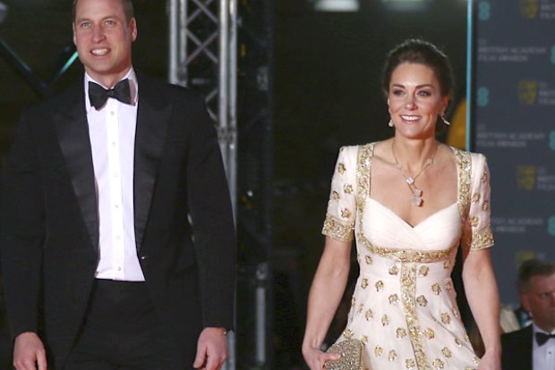 Prince William and Kate, Duchess of Cambridge pose for photographers upon arrival at the Bafta Film Awards, in central London, Sunday, Feb. 2 2020.
