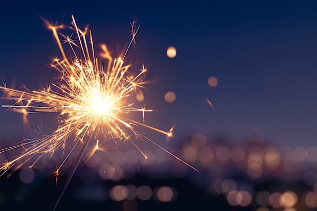 Sparkler with blurred city light background