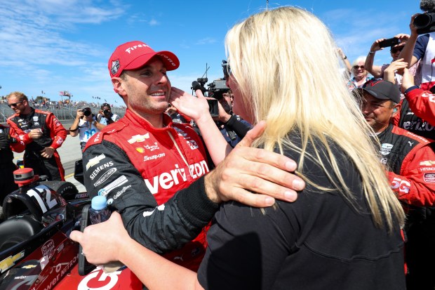 Will Power (left) and Liz Power after the Australian won the 2022 IndyCar Series title.