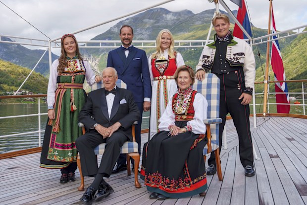 Norway's King Harald, Queen Sonja, front, Crown Prince Haakon, rear center left, Crown Princess Mette-Marit, rear center right, Princess Ingrid Alexandra and Prince Sverre Magnus aboard the Kingship Norway in the Geirangerfjord, Norway, Saturday Aug. 31, 2024, ahead of the wedding of Norway's Princess Martha Louise and Durek Verrett. (Cornelius Poppe/NTB via AP)