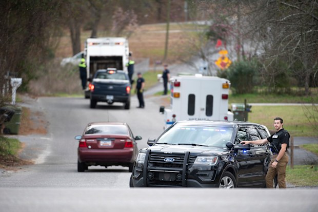 A Cayce police officer blocks an entrance to the Churchill Heights neighbourhood.