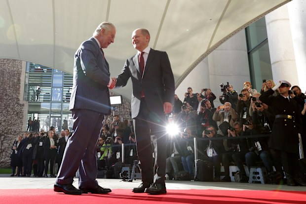 German Chancellor Olaf Scholz (R) welcomes Britain's King Charles III at the Chancellery on March 30, 2023 in Berlin, Germany. 