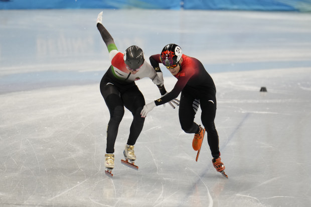 Shaolin Sandor Liu and Ziwei Ren compete during the men's 1000m final.