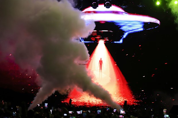 An avatar of El Salvador's President Nayib Bukele is projected on a LED screen descending from a flying saucer during the closing ceremony of a congress for cryptocurrency investors in Santa Maria Mizata, El Salvador.