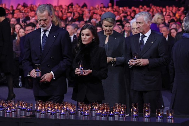 OSWIECIM, POLAND - JANUARY 27: King Felipe VI of Spain and Queen Letizia of Spain place lit candles in tribute to victims of the Holocaust as King Philippe of Belgium and Queen Mathilde of Belgium approach behind during the main ceremony for the 80th anniversary of the liberation of the Auschwitz camp on January 27, 2025 in Oswiecim, Poland. The Nazis built and operated the Auschwitz complex of concentration camps during World War II initially for slave labor and later for the mass extermination