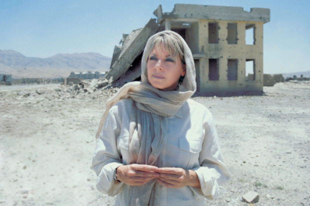 Hayes, pictured here in Afghanistan, has reported on the biggest events around the world.