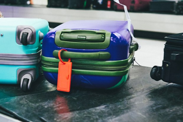 Shot of luggage on a conveyer belt at an airport