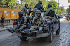 Members of the Haitian armed forces patrol the streets in Port-au-Prince, Haiti, Saturday, May 11, 2024.