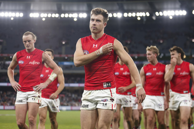 MELBOURNE, AUSTRALIA - APRIL 01: Zach Merrett of the Bombers leads the team off the field after the round three AFL match between St Kilda Saints and Essendon Bombers at Melbourne Cricket Ground, on April 01, 2023, in Melbourne, Australia. (Photo by Daniel Pockett/Getty Images)