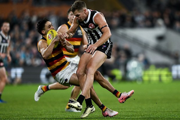Izak Rankine is knocked down after being bumped by Dan Houston.