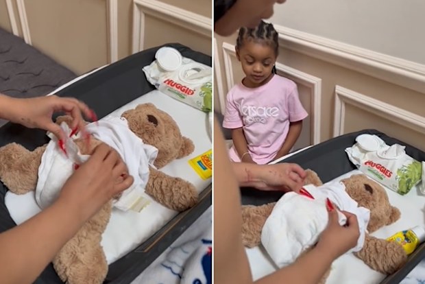 Cardi B changes diaper on teddy bear. 