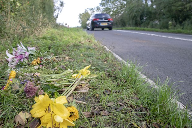 Floral tributes on the B4031 outside RAF Croughton, in Northamptonshire, where Harry Dunn, 19, died when his motorbike was involved in a head-on collision in August.