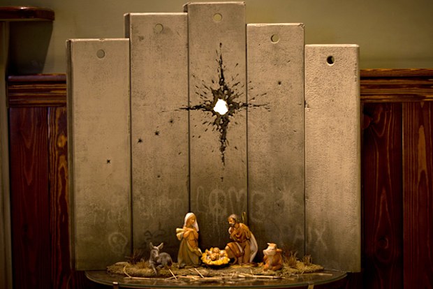 A new artwork dubbed "Scar of Bethlehem" by the artist Banksy is displayed in The Walled Off Hotel, in the West Bank city of Bethlehem