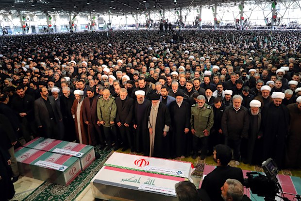 Iran's Supreme Leader Ayatollah Ali Khamenei (centre) leading a prayer as Parliament Speaker Ali Larijani, President Hassan Rouhani, Judiciary chief Ebrahim Raisi and the newly-appointed head of the Islamic Revolutionary Guards Esmail Qaani perform the prayer over the caskets of slain Iranian military commander Qasem Soleimani and Iraqi paramilitary chief Abu Mahdi al-Muhandis at Tehran University in the Iranian capital. 