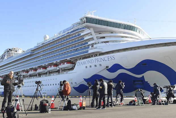 The Princess Diamond which 64 passengers and a crew have been found positive in a new type coronavirus test anchors at Daikoku Wharf in Yokohama