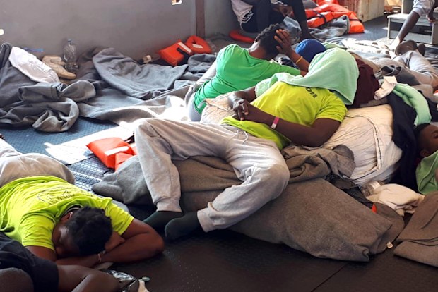 Some migrants on board the vessel Sea-Watch 3 at sea in the Mediterranean, 27 June 2019