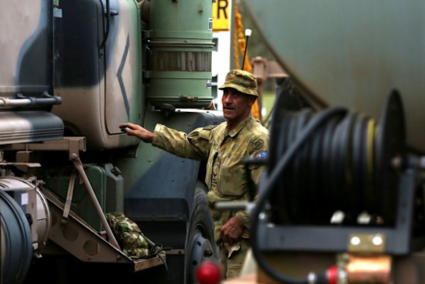 Corporal Justin Perry 4th Squadron 5ER is seen ahead of Australian Army Reserve and Regular personnel departing the Holsworthy Barracks to support bushfire efforts across NSW