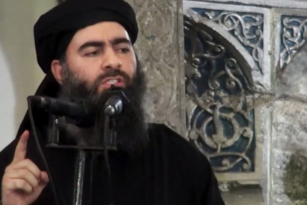 This image was released by Islamic State in 2014, purporting to show the leader of the Islamic State group, Abu Bakr al-Baghdadi, delivering a sermon at a mosque in Iraq during his first public appearance.
