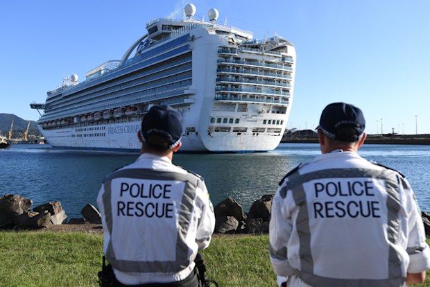 NSW Police Rescue officers look on as the Ruby Princess, with 1040 crew  onboard, docks at Port Kembla, Wollongong.