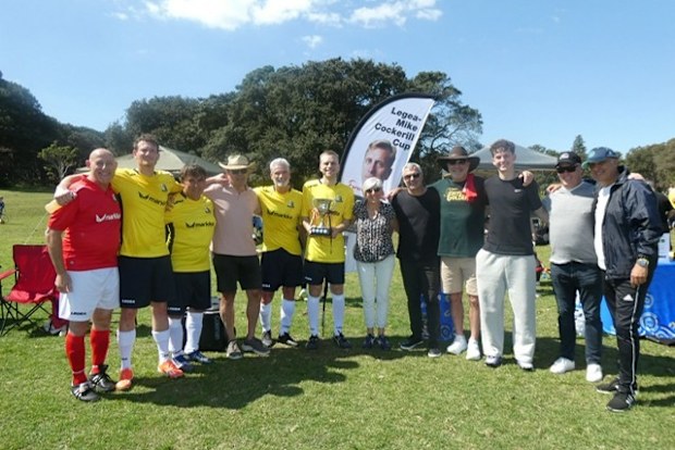 Prominent football figures line up for a photo after their involvement in the 2025 Mike Cockerill Cup.