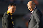 Suntory Sungoliath director of rugby Eddie Jones speaks with coach Kiyonori Tanaka.