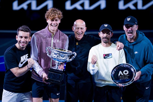 Jannik Sinner is flanked by physio Giacomo Naldi (left) and fitness coach Umberto Ferrara (right).
