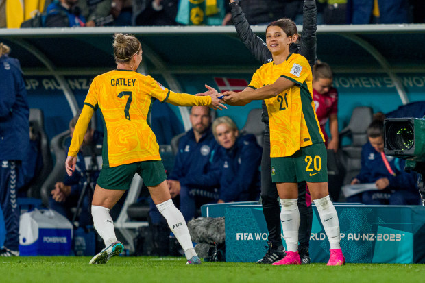 SYDNEY, AUSTRALIA - AUGUST 07: Steph Catley hands Sam Kerr the captain's armband during the FIFA Women's World Cup Australia & New Zealand 2023 Round of 16 match between Australia and Denmark at Stadium Australia on August 07, 2023 in Sydney, Australia. (Photo by Andy Cheung/Getty Images)