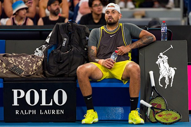Nick Kyrgios slumps in his chair during his Australian Open round one loss against Jacob Fearnley.  