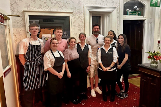 Hugh Jackman with hotel staff