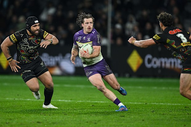 Cameron Munster of the Melbourne Storm runs the ball.